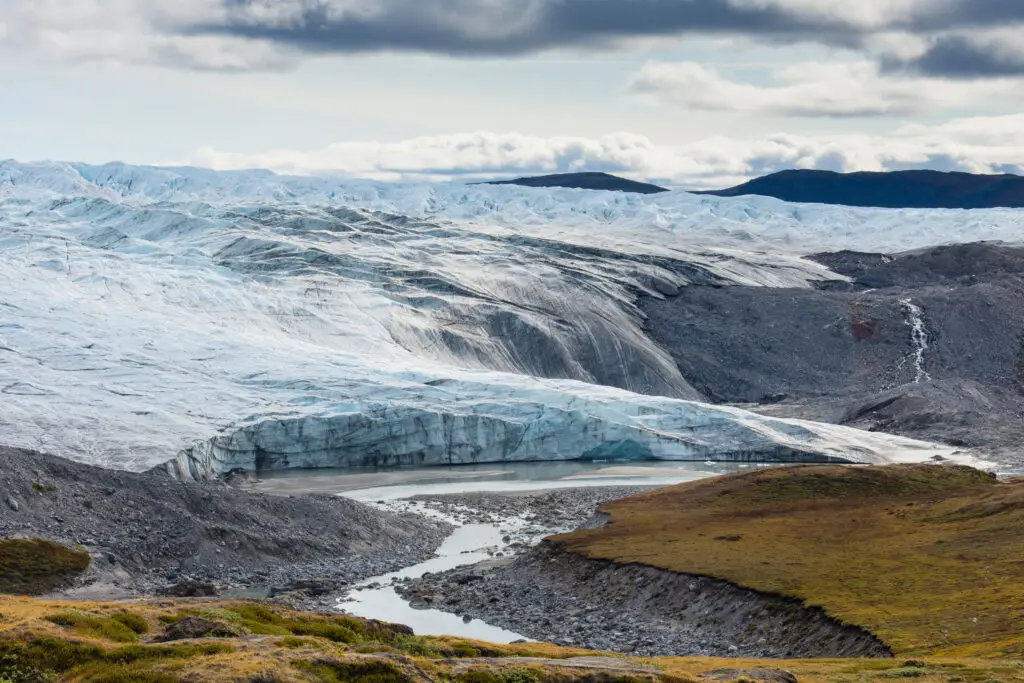 Retreating Russell Glacier at Kangerlussuaq, showing vast ice cap and landscape in Greenland.